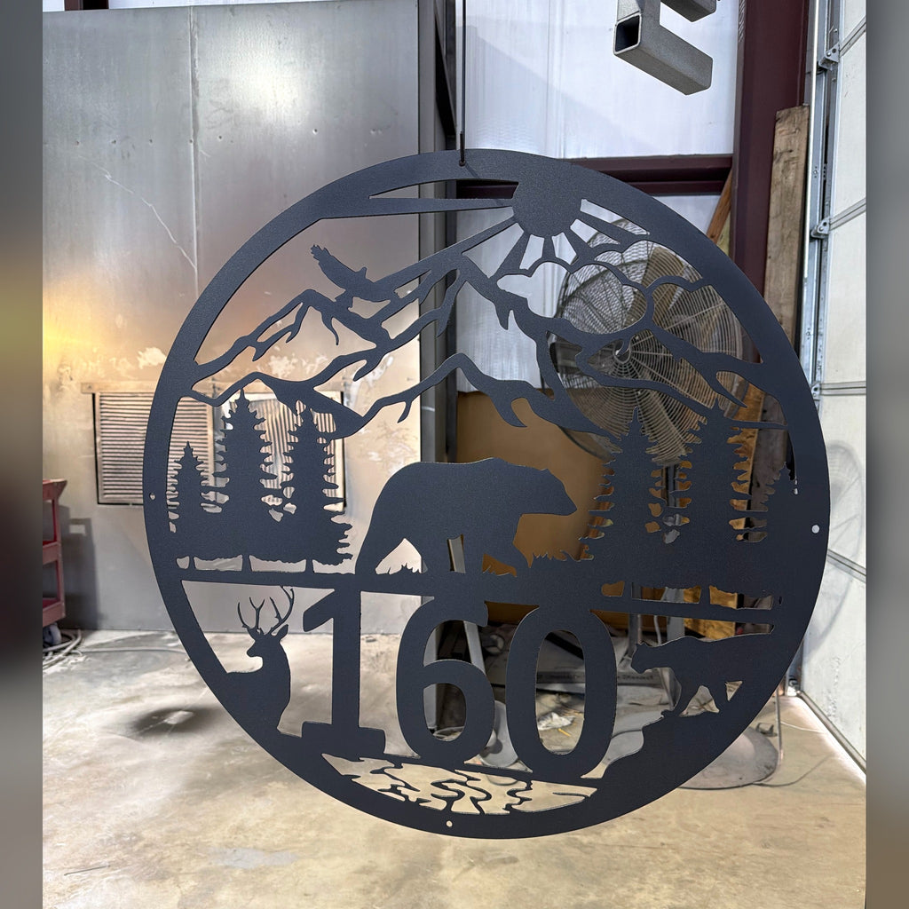 Round black mountain bear and deer address sign with house number 160, finished in our shop