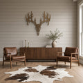 Deer Skull & Antlers Metal Wall Art in bronze, shown in a farmhouse living room
