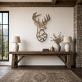 Geometric Buck Head Metal Wall Art in bronze, shown in a mountain lodge living room
