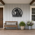 Labrador in the Cattails Welcome Sign in black, shown in a covered front porch