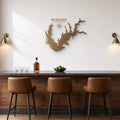 Lake Ray Roberts Map Metal Wall Art in bronze, shown in a home bar
