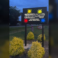 Collin County Paintball LED backlit post sign lit up at dusk, built by American Made Metalworks