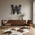 Split Letter Family Monogram Metal Sign (A–Z) in black, shown in a farmhouse living room