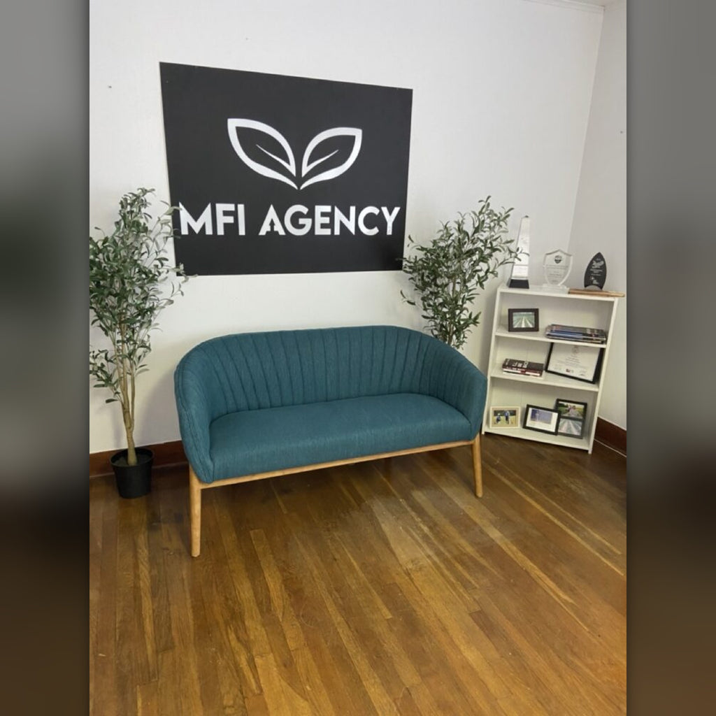 MFI Agency steel logo on office wall