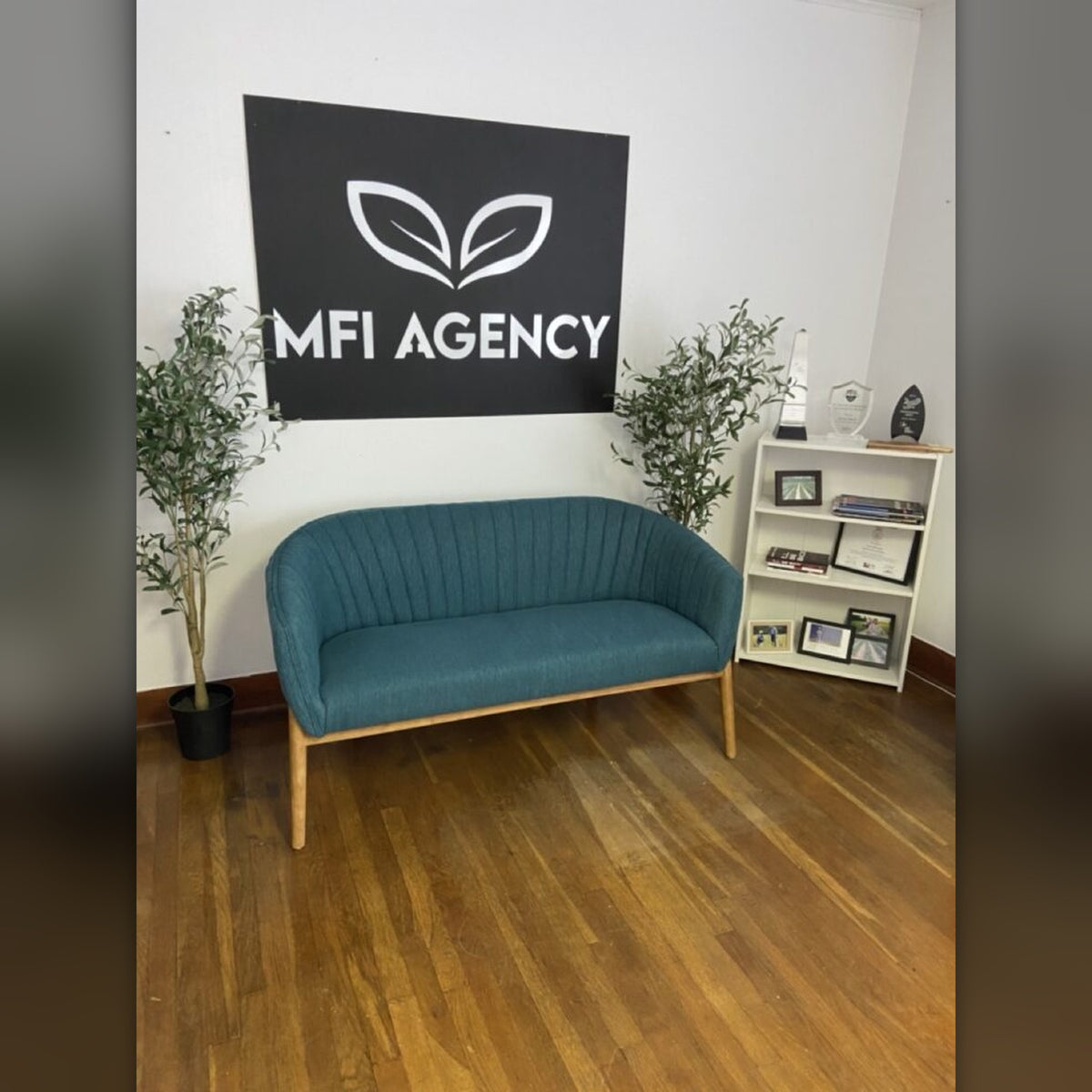 MFI Agency steel logo on office wall