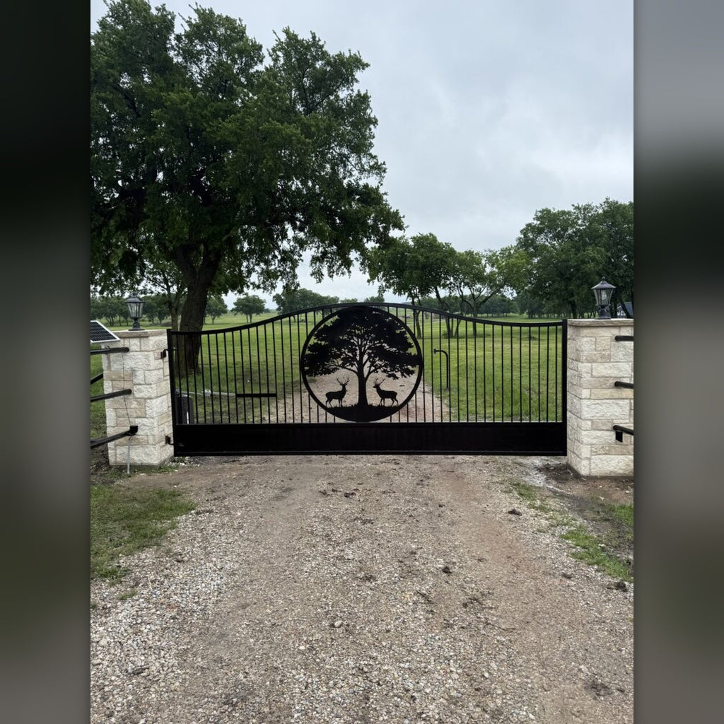 Custom steel tree emblem on ranch gate