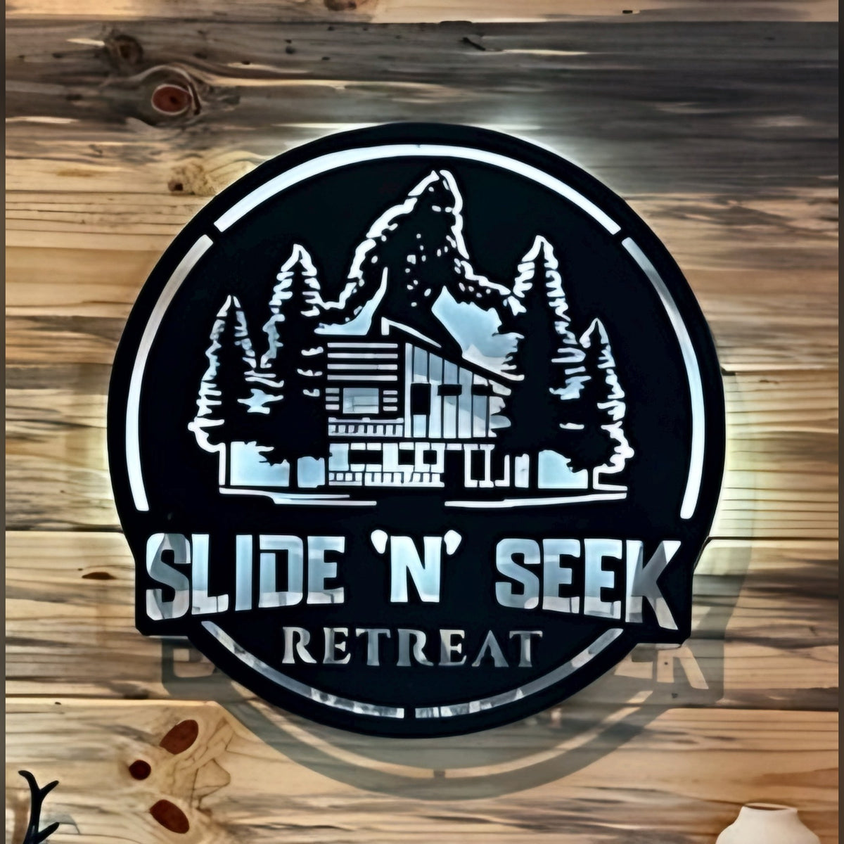 Slide N Seek Retreat round LED backlit metal sign