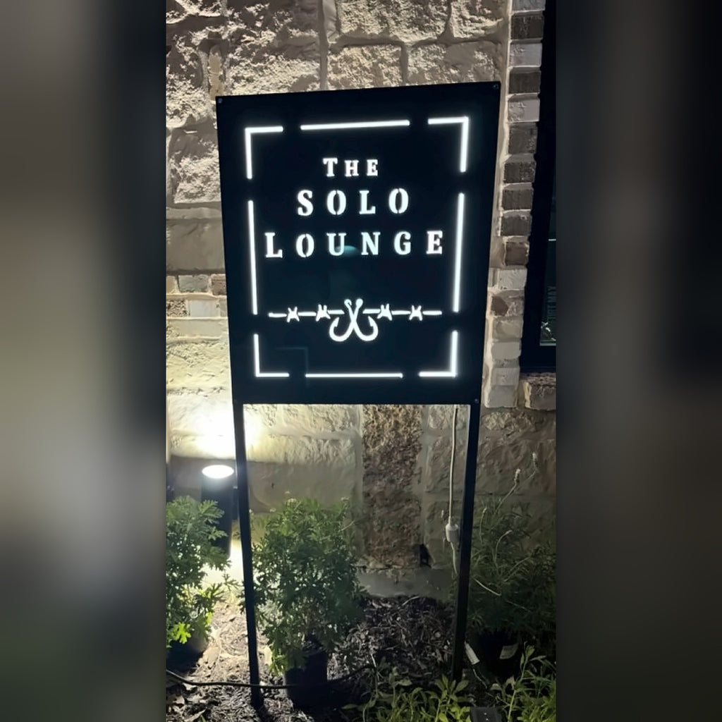 The Solo Lounge LED backlit sign at night